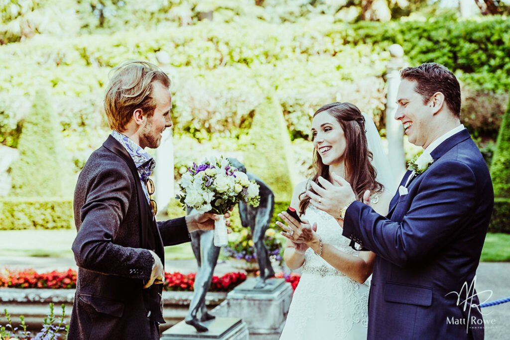 wedding-gallery-wide-03 Wedding magician performing for the bride and groom in the garden.