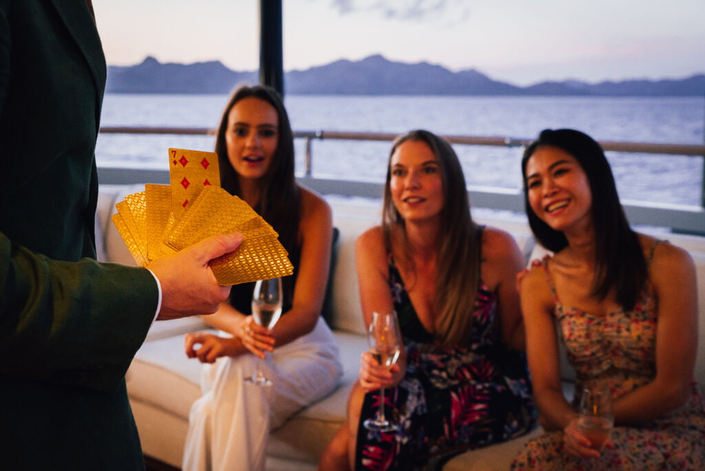 HH_08509 Chris Dodd Magic, superyachts magician, entertaining the guests. Yacht entertainment for yacht charters.