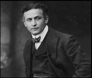 Famous magicians - Historic black and white portrait of Harry Houdini, the world’s most famous magician known for his escape acts.
