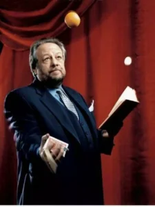 Famous magicians - Ricky Jay with a deck of cards in hand, renowned as a famous magician and magic historian.