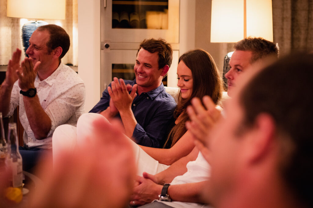 Crew Applause Yacht guests laughing and applauding at Chris Dodd's magic show, Overboard