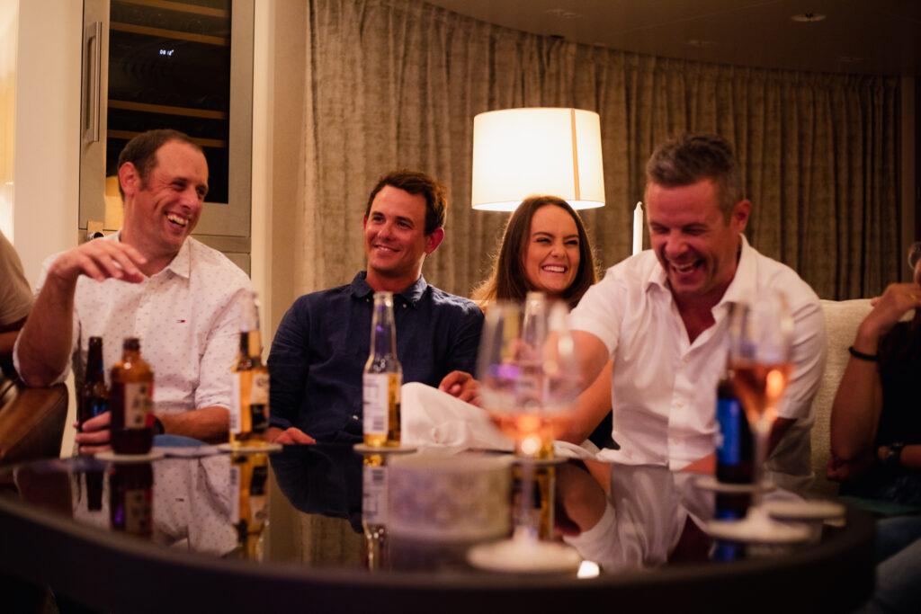 Laughing Crew 2 Yacht guests laughing during Chris Dodd's show, Overboard