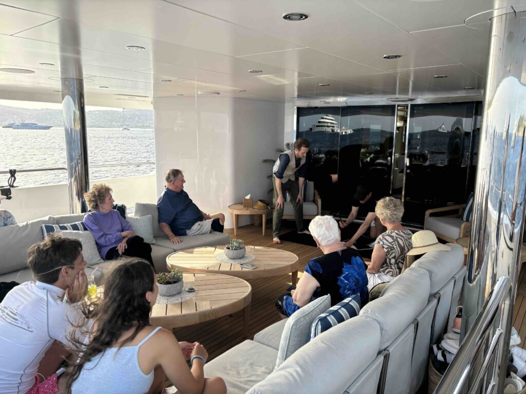 Overboard Finale Chris Dodd performing part of his Overboard finale to a wonderful group of charter guests. Yacht entertainment at its best. Italy, Greek Islands, French Riviera.